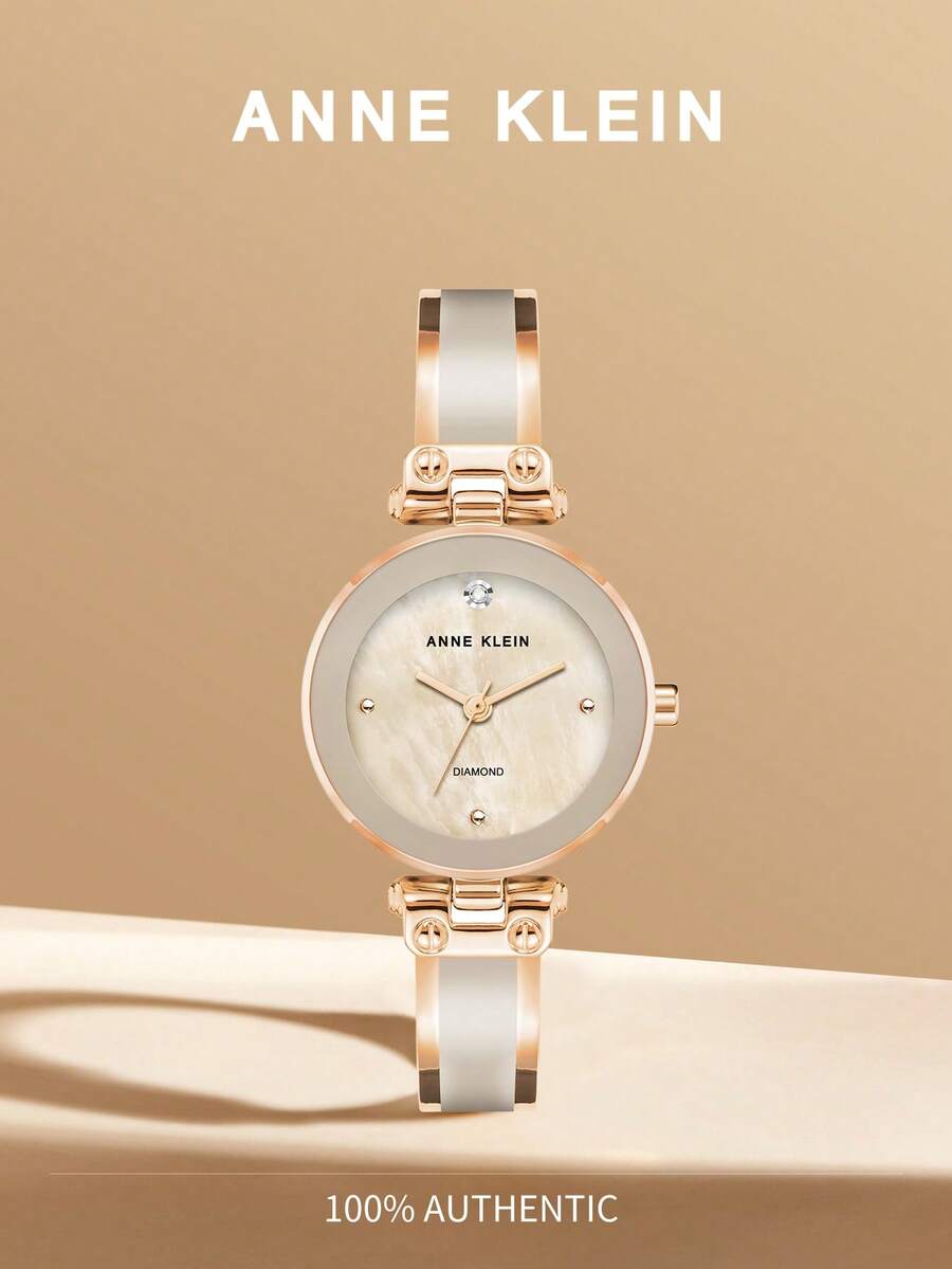 Anne Klein ساعة سوار ذهبية وردية اللون بحجر كوارتز للنساء، ساعة فاخرة مرصعة بالماس مع قرص من صدف اللؤلؤ الوردي الفاتح، ساعة أنيقة للاستخدام اليومي، هدية ساعة أنيقة للسيدات، AK/1980BMRG