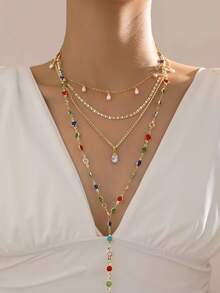 4 قطع طقم قلادة للنساء، قلادة طويلة متعددة الطبقات على شكل حرف Y، تصميم أنيق وفريد من نوعه، طراز مبالغ فيه أنيق، مرصعة بأحجار كريمة اصطناعية لامعة، سلسلة ذهبية، قلادة قطرة لؤلؤ اصطناعي، مناسبة للاستخدام اليومي والحفلات والهدايا