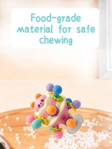 彩虹星球小熊益智抓握玩具，带吸盘旋转功能，附赠12颗磨牙球。这款小熊造型的旋转玩具适合作为圣诞节、万圣节和感恩节礼物。