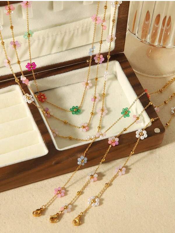 Conjunto de collar y pulsera de acero inoxidable con flor delicada para mujer