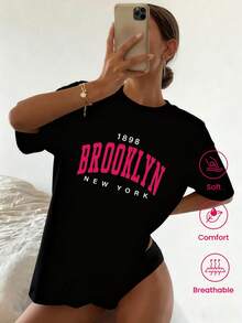 Camiseta de cuello redondo y mangas cortas de ropa fashion, fabricada en México, para la temporada primavera-verano 2025. Con estampado de dibujos animados, es un modelo de pareja, apta para usar tanto por dentro como por fuera, ideal para oficina y estilo casual, diseñada para hombres y mujeres, en unidad individual. - Negro - Ver 1