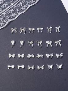 50 قطعة مجموعة متنوعة من الفيونكات المطلية بالفضة ثلاثية الأبعاد بتصاميم بسيطة، سلسلة فيونكات الراتنج المختلطة، إكسسوارات متعددة الوظائف DIY لتزيين الأظافر والشعر والهواتف والأقراط والألبومات، تزيينات أظافر وأحجار أظافر - فضي - مشاهدة 3