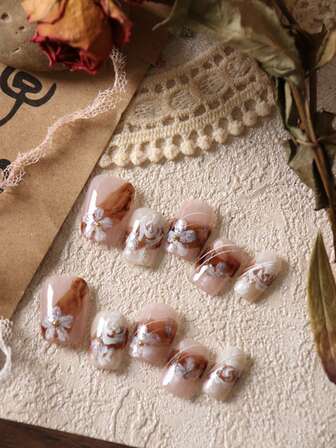 10 piezas de uñas postizas acrílicas en estilo de pintura al óleo en colores café claro, marrón, blanco y rosa. Uñas falsas cortas para uso diario en la oficina. El kit incluye 1 hoja de adhesivos y 1 lima de uñas mini.