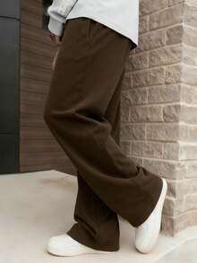 1 件男士抽绳腰宽松阔腿休闲运动裤，秋冬