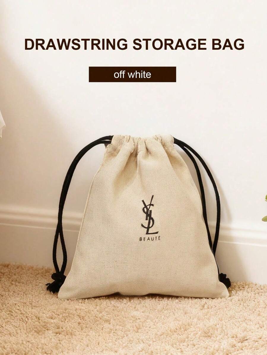 Yves Saint Laurent 化妆品抽绳收纳袋，白色帆布化妆包，黑色Logo和抽绳，可重复使用的化妆品收纳袋。 - 米白色 - 查看 1