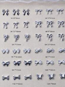 50 قطعة مجموعة متنوعة من الفيونكات المطلية بالفضة ثلاثية الأبعاد بتصاميم بسيطة، سلسلة فيونكات الراتنج المختلطة، إكسسوارات متعددة الوظائف DIY لتزيين الأظافر والشعر والهواتف والأقراط والألبومات، تزيينات أظافر وأحجار أظافر - فضي - مشاهدة 6