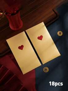1/18个高品质情人节红包，采用金色箔片设计，饰有皇冠和蛋糕元素，适用于新年、生日等场合，质感面料凸显品质，适用于节日送礼、庆祝祝福等场合，适合注重礼仪的人士和送礼者，适用于春节、情人节和派对等场合。