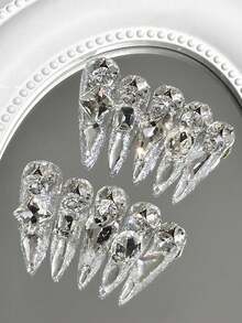 Bộ 10 móng giả đính đá hình hạnh nhân cao cấp, đá lấp lánh không đối xứng, phụ kiện làm móng sang trọng, phù hợp cho sử dụng hàng ngày, dự tiệc, đám cưới và nhiều dịp khác, có thể tái sử dụng với keo dán móng đi kèm. Móng giả dán thủ công. - Bạc - Xem 11