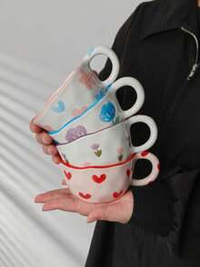 1个彩色花卉爱心图案陶瓷杯，甜美风格陶瓷马克杯，不对称造型，手工绘制细节，适合盛装咖啡和其他饮品，是少女风家居装饰和春季朋友聚会的理想之选。 - 彩色 - 查看 2