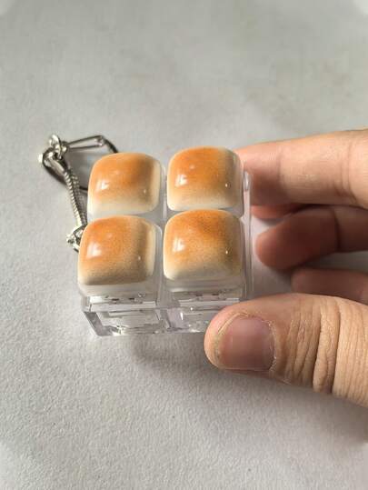 1pc Caramel Bread Shaped Keychain, Stress Relief Fidget Toy, Mechanical Keyboard Switch Tester, Keyring, Desktop Decor, Phone Charm, Creative Novelty Anti-Anxiety Finger Toy