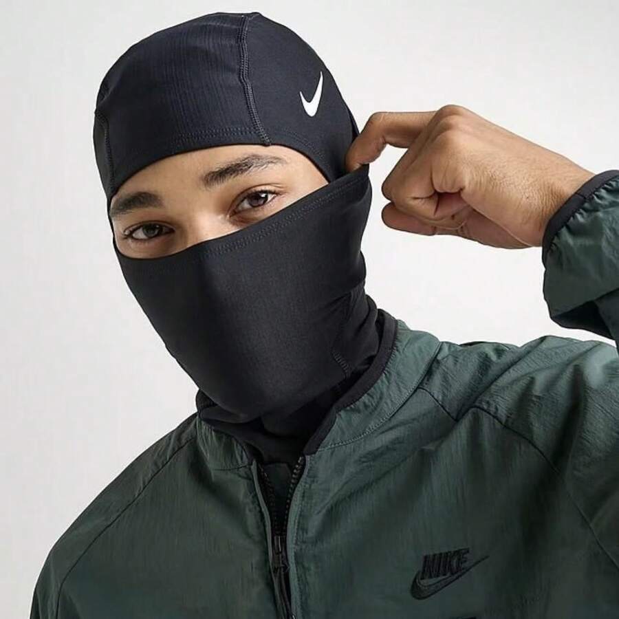 Nike Pro Hyperwarm Hood Thermal Fabric: Nike Therma-FIT Technology Helps Manage Your Body Heat To Keep You Warm In Cold Conditions. Flat Seams: Flat Seams Feel Smooth Against Your Skin, Reducing Irritation During Wear. Versatile Design: Form-Fitting Design Can Be Worn On Its Own Or Under A Helmet, And It's Convertible To A Neck Gaiter For Custom Warmth. Stretchy And Lightweight: Designed For Optimal Flexibility, This Hood Provides A Snug Fit Without Restricting Movement. - màu đen - Xem 1