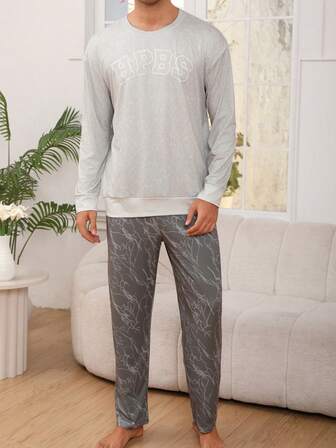 男士休闲睡衣套装，轻薄圆领长袖字母印花上衣搭配印花长裤，舒适时尚的春秋季居家服套装。