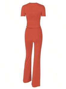 بدلة رياضية للنساء تتكون من توب قصير الأكمام وبنطال واسع مربوط الخصر، مناسبة لفصلي الربيع والخريف - البرتقالي - مشاهدة 2