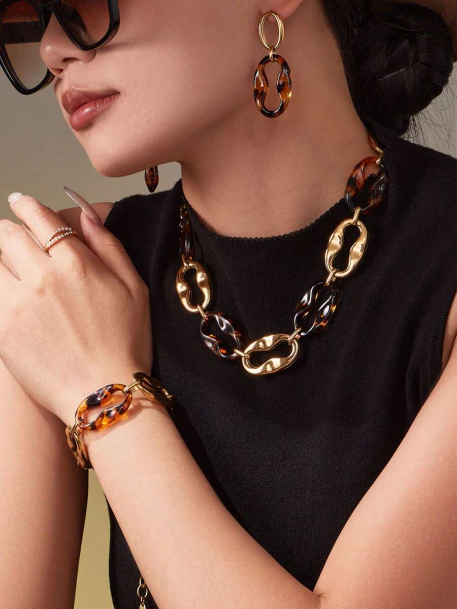 1 Set de joyería vintage con estampado de leopardo, que incluye pulsera de acero inoxidable con nariz de cerdo de resina, aretes y collar, un diseño único - Dorado - Ver 1