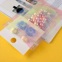50 Stück regenbogenfarben transparente selbstversiegelnde Beutel, Laser-selbstversiegelnde Beutel - halbtransparente farbige Geschenkverpackung geeignet für Ohrringe, Schmuckgeschenke usw. - Verschiedenfarbig - Übersicht 8