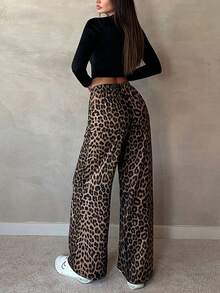 Pantalones largos rectos con cintura elástica y estampado de leopardo.Pantalones de diseño con estampado de leopardo para mujer, estilo chic y desenfadado. Pantalones rectos de cintura alta. Pantalones anchos y holgados con elegante caída. Pantalones largos hasta el suelo con silueta fluida. - Negro - Ver 4