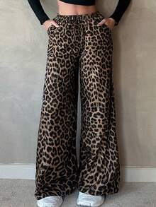 Pantalones largos rectos con cintura elástica y estampado de leopardo.Pantalones de diseño con estampado de leopardo para mujer, estilo chic y desenfadado. Pantalones rectos de cintura alta. Pantalones anchos y holgados con elegante caída. Pantalones largos hasta el suelo con silueta fluida. - Negro - Ver 2