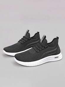 Zapatillas de running para hombre de malla transpirable en color liso, con un diseño clásico y minimalista. Zapatillas deportivas de suela plana con detalles de letras entrelazadas. Zapatillas ligeras y cómodas adecuadas para correr, hacer footing, entrenar a diario, ir al gimnasio, realizar actividades al aire  llevar con ropa informal. - Negro - Ver 7