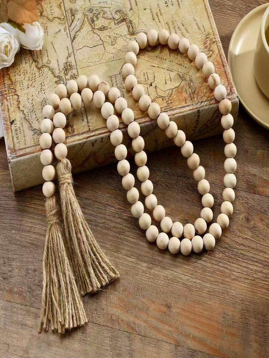 A Wooden Beaded Wreath With Jute Tassels, A Bohemian Style, Rustic Farmhouse Decor, A Handcrafted Home Decor Accessory For Holiday Dining Tables And Living Rooms. - Beige - View 1