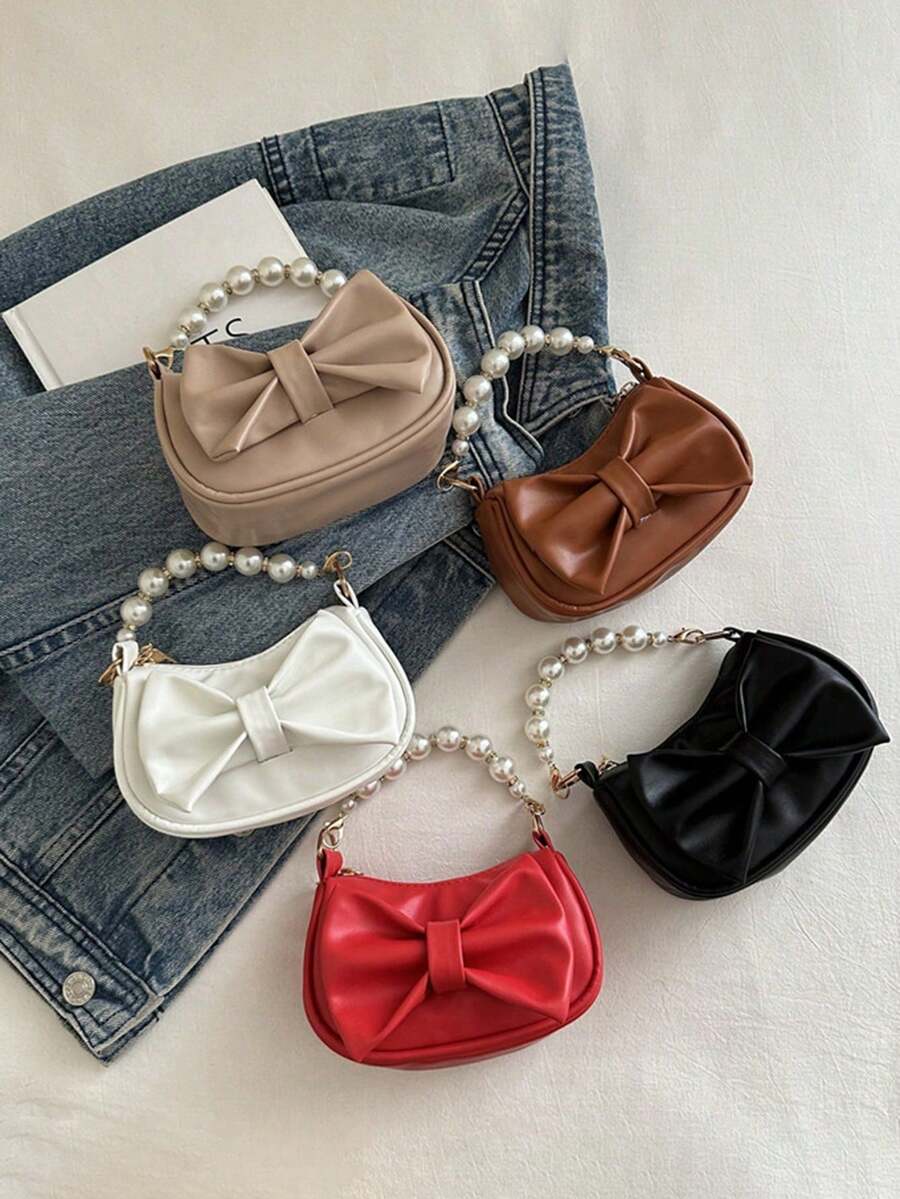 Este es un nuevo y lindo bolso de mano de nicho de alta gama con decoración de lazo. Es una nueva bolsa de moda y con un esquema de color fresco y vibrante. Se puede llevar en la mano, pero la correa para el hombro no es ajustable. Es casual pero elegante, perfecto para salir y también hace un gran regalo para amigos. - Bolsos de moda - Ver 1