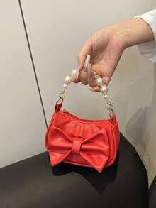 Este es un nuevo y lindo bolso de mano de nicho de alta gama con decoración de lazo. Es una nueva bolsa de moda y con un esquema de color fresco y vibrante. Se puede llevar en la mano, pero la correa para el hombro no es ajustable. Es casual pero elegante, perfecto para salir y también hace un gran regalo para amigos. - Bolsos de moda - Ver 14