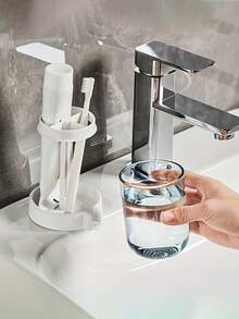 This All-In-One Bathroom Toothbrush Holder Features A Dust Cover, Toothpaste And Toothbrush Cup Holder, And A Drainable Cup Holder. It Is A Multi-Functional Household Toothbrush Holder And Bathroom Toothbrush Case. It Can Easily Store Your Toothbrush And Toothpaste, Keeping Your Bathroom Countertop Clean And Tidy.
