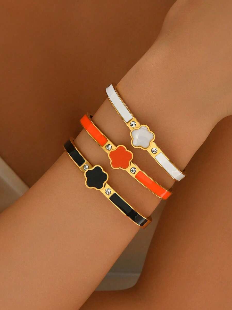 1条五叶草手链，经典黑、橙、白配色，金色边框镶嵌闪亮水钻，精致小巧，可单独佩戴或叠戴，时尚女士饰品。 - 五葉草 - 查看 1