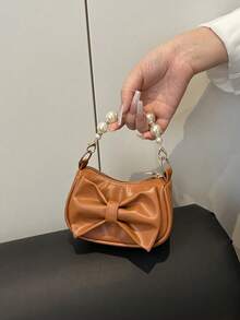 Este es un nuevo y lindo bolso de mano de nicho de alta gama con decoración de lazo. Es una nueva bolsa de moda y con un esquema de color fresco y vibrante. Se puede llevar en la mano, pero la correa para el hombro no es ajustable. Es casual pero elegante, perfecto para salir y también hace un gran regalo para amigos. - Bolsos de moda - Ver 12