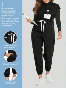 Cimmuovere Mono de talla grande con manga corta, cintura anudada, pliegues, cremallera y cuello alto - Negro - Ver 1