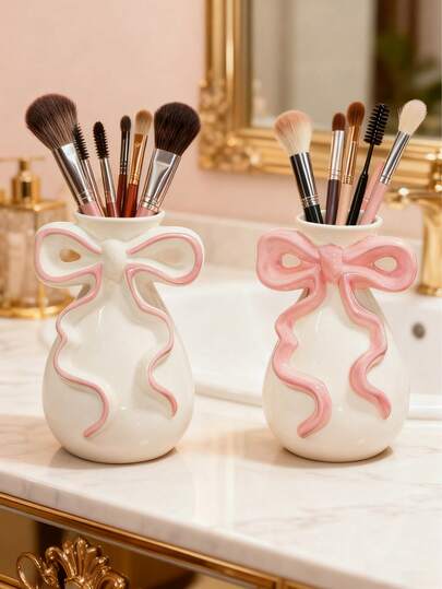 1 pieza Caja de almacenamiento con forma de lazo, adecuada para brochas de maquillaje y cosméticos en el baño. Este elegante soporte para brochas de maquillaje es perfecto para chicas, estudiantes y decoración del hogar creativa. También es adecuado para vacaciones, playa, baño, dormitorio y talla grande. Gran capacidad.