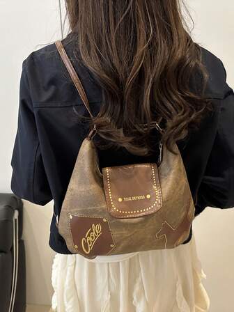 2025秋冬新款复古拼接狗狗手提包：大容量，肩背/手提两用，通勤休闲皆宜，趣味五金细节，秋冬时尚女包