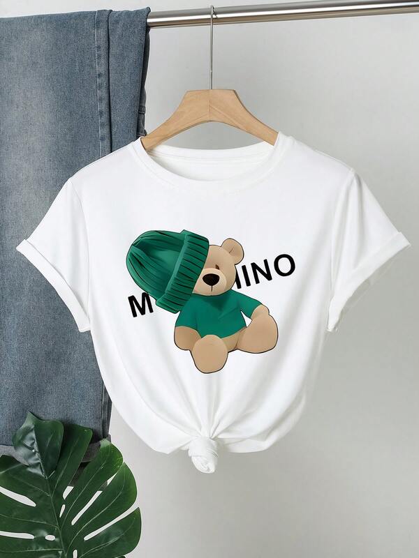 Women's Casual Short Sleeve Round Neck T-Shirt - Cartoon Bear Print Design With Green Knitted Cap And "MUCHINO" Text