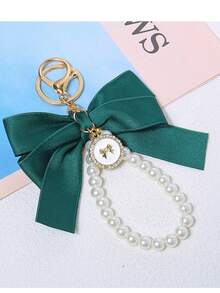 1 chiếc móc khóa trang trí hộp đựng tai nghe nơ ngọc trai lớn mới - Nhiều màu - Xem 7