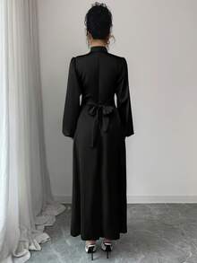 Đầm dài dáng chữ A thanh lịch dành cho nữ, cổ đứng, tay dài, vạt xòe, chất liệu vải dệt, chi tiết thắt nút, màu đen, thích hợp cho mùa xuân. - màu đen - Xem 3