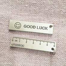 2 件装迷你黄铜尺钥匙扣 - 二合一测量工具 + 身份标签，纯黄铜材质，笑脸设计，适合学生、专业人士及日常携带，2.36 英寸小巧尺寸