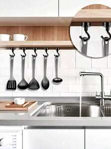 Bộ 5 móc từ tính mạnh mẽ, được làm từ nam châm Neodymium với móc từ tính, tiện lợi để treo đồ. Những móc từ tính mạnh mẽ, chống gỉ này có nhiều công dụng, lý tưởng cho du lịch trên tàu biển, xe RV, đồ dùng cắm trại, dụng cụ nướng BBQ, dụng cụ nhà bếp, lưu trữ trong tủ lạnh, tường nhà để xe, studio, nhà kho, sân hiên, ban công, sắp xếp tủ quần áo, phụ kiện du lịch ngoài trời, trang trí Halloween, Lễ Tạ ơn, Giáng sinh và các ngày lễ khác. Những giải pháp lưu trữ đa chức năng tiết kiệm không gian này đi kèm với miếng dán bảo vệ dễ bóc. - màu đen - Xem 3