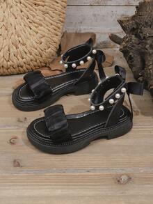 1 par de sandalias de moda con suela gruesa para niñas de talla grande, en color negro, con tiras de malla con volantes, lazo de tela en el talón, perla, cierre, diseño de punta redonda simple, cómodas y lindas sandalias romanas para la playa, adecuadas para niñas de 3 a 15 años, primavera/verano - Negro - Ver 2