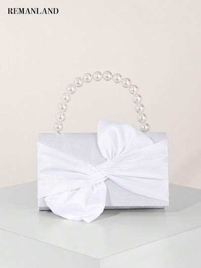 REMANLAND 这款时尚优雅的女士手提包饰有珍珠手柄和蝴蝶结，是晚宴包和派对包的完美之选。这款肩包适合出席派对、婚礼、宴会和招待会的女士，是送给任何女性的理想礼物。