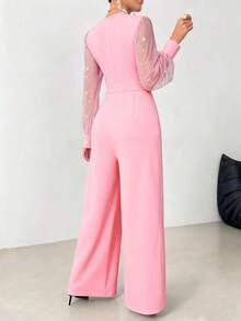 Eegant V-Neck Jumpsuit - Long Sleeve, Sheer Mesh Panel, Rivet Accents