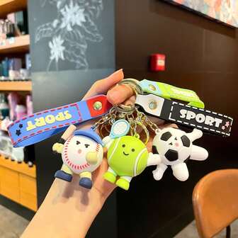 Un llavero original de juguete deportivo, un divertido llavero de mochila de bádminton de dibujos animados y un recuerdo creativo relacionado con el tenis para una competencia.