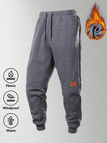 男士保暖运动裤，带口袋和抽绳，撞色皮革贴片，腰部可调节，裤脚收口，穿着舒适。 - 深灰色 - 查看 9