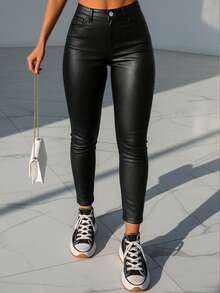 Pantalones pitillo de cintura media de cuero sintético para mujer con bolsillos en diagonal, una elección perfecta para los atuendos navideños.