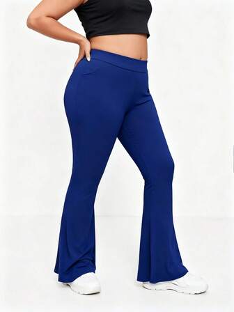 Pantalones deportivos casuales de nailon suave y elástico para mujer talla grande, pantalones de yoga con pierna acampanada y bolsillos, ajuste delgado para uso diario al aire libre