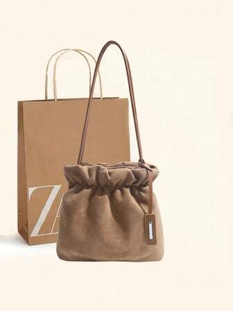 秋冬时尚复古麂皮手提包，休闲百搭女士单肩包，拉链封口，褶皱设计，优雅配色，大容量水桶包，适合日常通勤、约会、购物等场合。