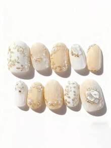 10片纯手工制作的中长椭圆形美甲贴片，黄白相间的猫眼图案，饰以金色小花，可爱精致，柔和闪亮，优雅迷人，适合女性和女孩，春夏秋冬皆宜，节日及日常使用。 - 黃色 - 查看 1