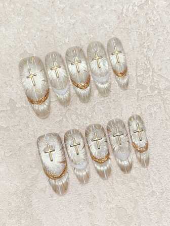 10片椭圆形金色闪粉猫眼美甲贴纸，手绘线条搭配3D石膏点缀，可重复使用，适合派对、音乐会、日常佩戴，尽显高端质感。