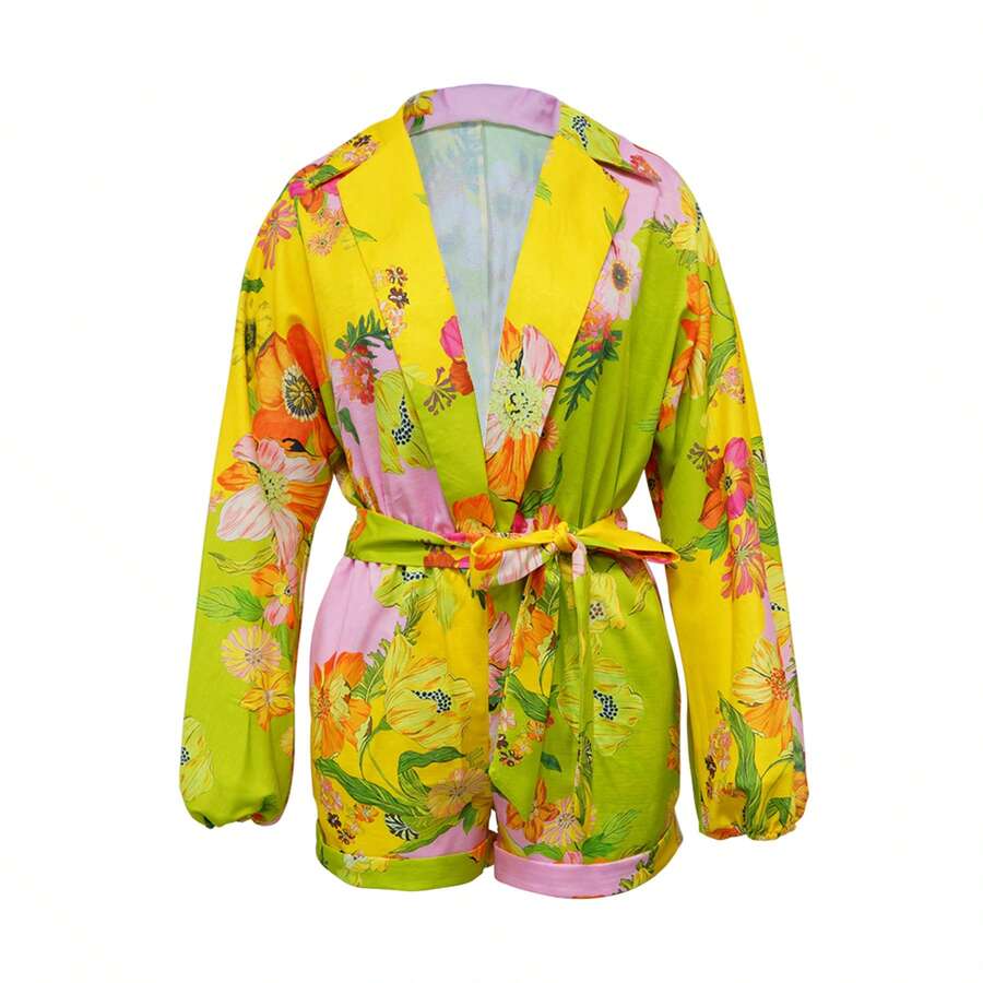 Mono de mujer con estampado floral, mangas farol, bolsillo y cuello de solapa