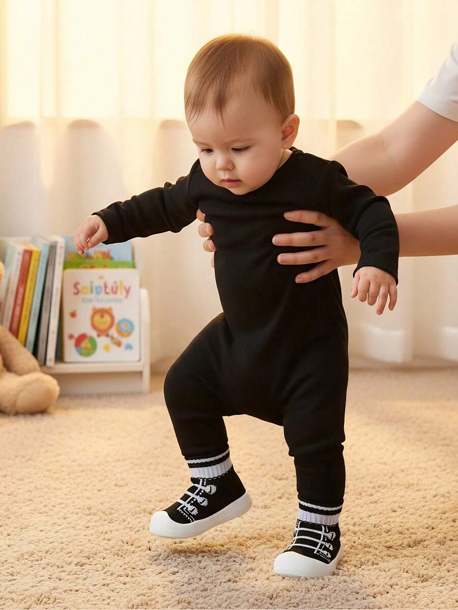 أحذية مشي أطفال رضع وأطفال صغار، أحذية مطاطية ناعمة مزينة بنمط شريط ربط مزيف، مضادة للانزلاق، مناسبة للداخل والخارج في فصلي الربيع والخريف، للأولاد والبنات - الأسود - مشاهدة 1