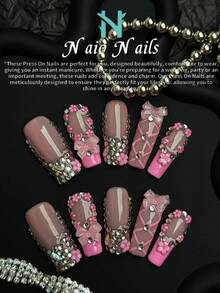 NAIO 10片装情人节手工美甲贴片套装，方形Y2K复古风，裸色和粉色可选。款式包括法式美甲设计、蝴蝶结、五瓣花和水钻装饰。适合日常妆容，也适合派对、庆典和其他各种场合。套装还包含美甲工具，是送给女性和女孩的绝佳情人节礼物。 - 彩色 - 查看 1