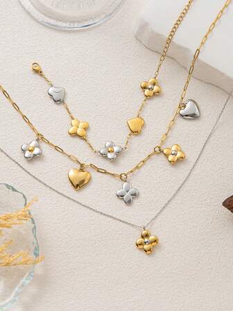 这款时尚精致的不锈钢心形四叶草花手链项链，镀18K金，展现女性独特魅力。适合女性日常佩戴、社交及宴会装扮，也可作为护身符或在音乐节上佩戴。女士珠宝。